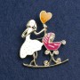 Brooch 'Mom with a Cradle', white and raspberry enamel, gold metal 46x38mm