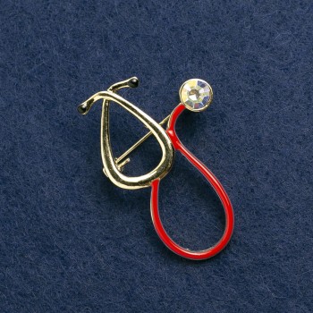 Stethoscope Brooch, red enamel with pink stone, gold-tone metal, 41×28mm
