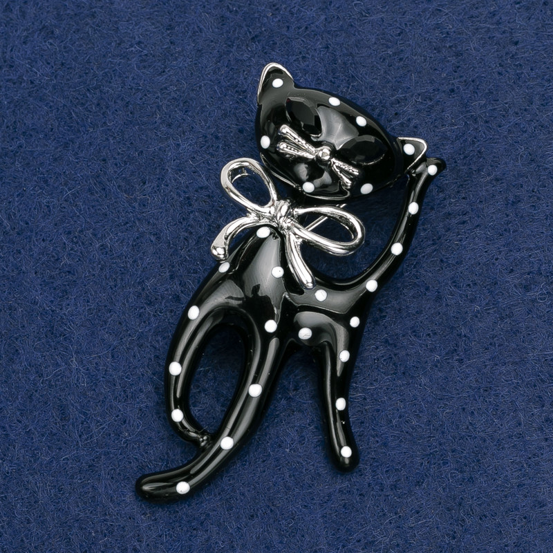 Brooch 'Kitty' acrylic white and black on silver metal 53×25 mm