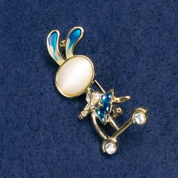 Brooch 'Bunny on a Scooter' with White Crystals, Gold-Toned Metal, Blue Enamel, Cat's Eye Cabochon (White) 43×21 mm +