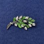 Brooch Twig with Green Cat's Eye, White Crystals, Silver Metal, diameter 50x27mm+