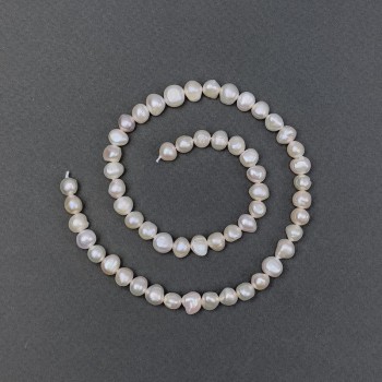 Freshwater pearls with a gasoline shade on a thread, diameter 6.5×4.5 mm, length 36 cm