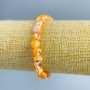 Bracelet with light-orange mother-of-pearl faceted beads, 8x6 mm diameter, length 18 cm (stretch)