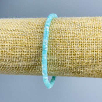 Bracelet made of blue-toned mother-of-pearl discs, diameter 4×2 mm, length 18 cm (stretch)