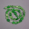 Beads on a thread Green crystal, tinted to chrome diopside, faceted, diameter 10x12 mm, length 39 cm