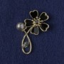 Brooch Flower black mother-of-pearl, crystal, bead, golden metal 33×51 mm
