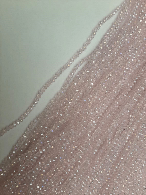 Beads Czech Crystal Pink Transparent Faceted Rondelle with a Gasoline Tint, Diameter 3.5×3 mm ±, Length 39 mm ± on a Thread