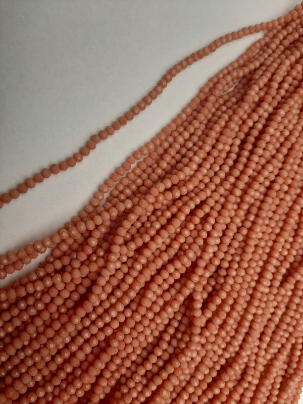 Beads Czech Crystal Peach Faceted Rondelle, diameter 3.5×3 mm, length 38 mm on beading thread