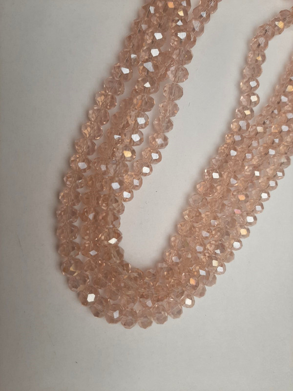 Beads Czech Crystal light pink transparent faceted rondelle with a "gasoline" tint, diameter 8x6mm, length 39mm, on thread