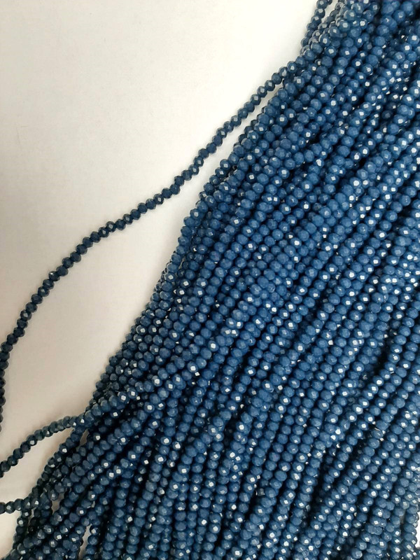 Beads Czech Crystal Dark Azure Faceted Rondelle, diameter 3×2.5 mm, length 39 mm on beading thread