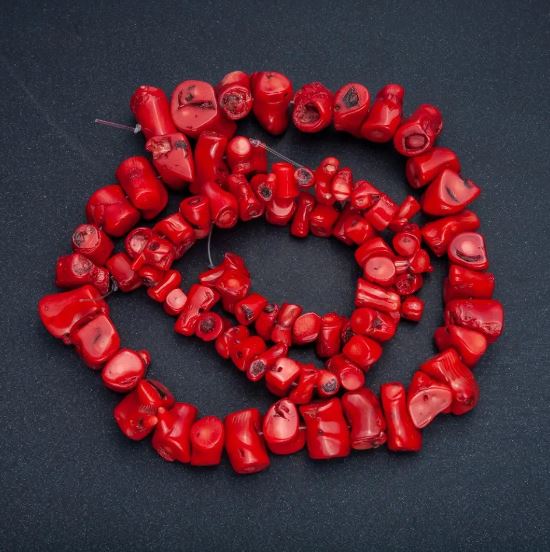 Faceted natural coral beads assortment in sizes, diameters from 12x10 to 30x12 mm, length about 38 cm, price per 100 g, on fishing line