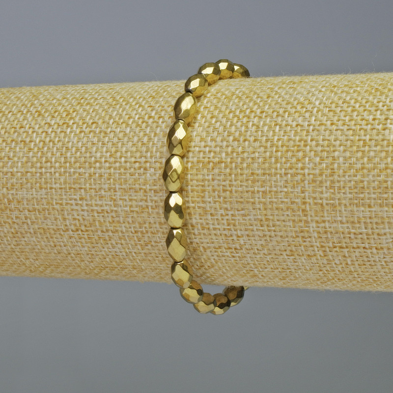 Gold-colored faceted hematite bracelet, oval beads, diameter 5x8 mm, length 18 cm, stretch