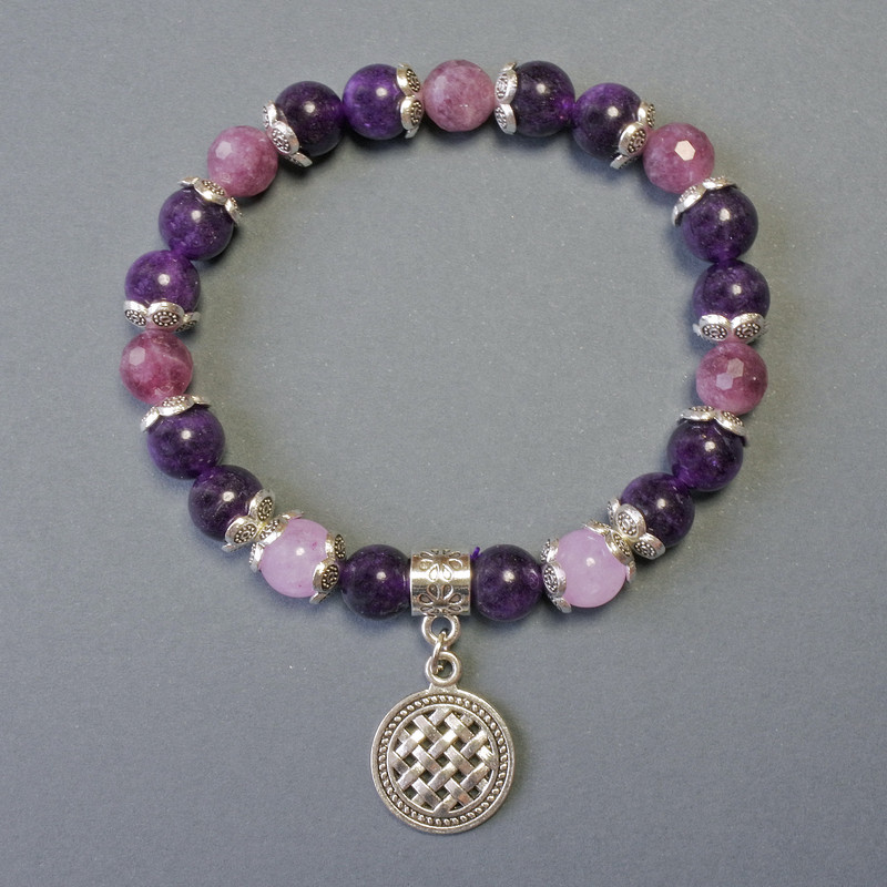 Bracelet with rubellite tourmaline faceted beads, 8 mm diameter; smooth sugilite beads, 8 mm diameter; with metal inlays, length 18 cm; elastic
