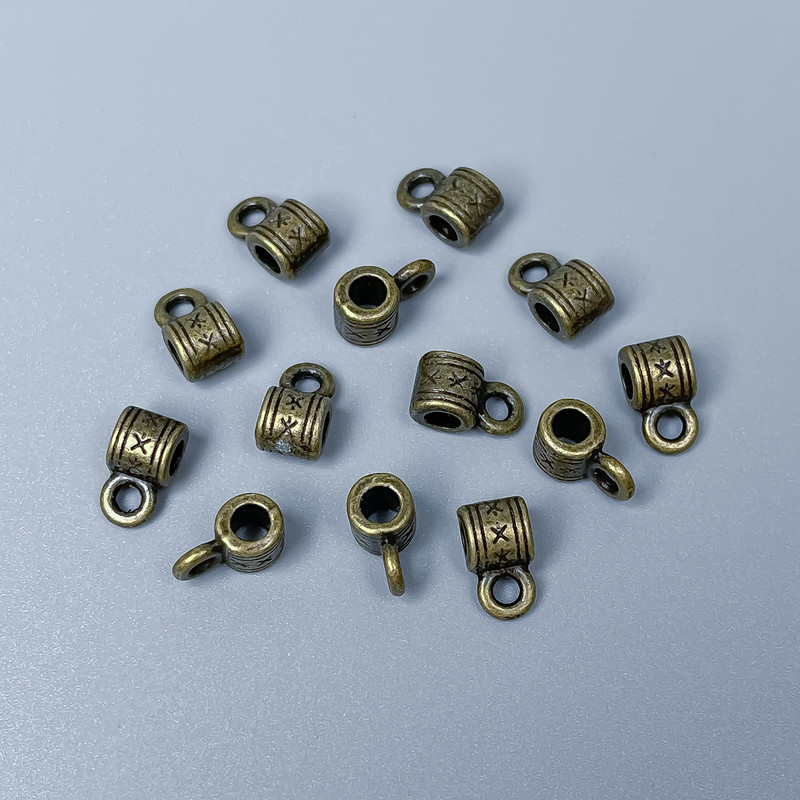 Bronze-colored bail hardware, size 9x5x5 mm ±, hole diameters 2.5 mm ± and 2 mm ±, packaging 34 pcs