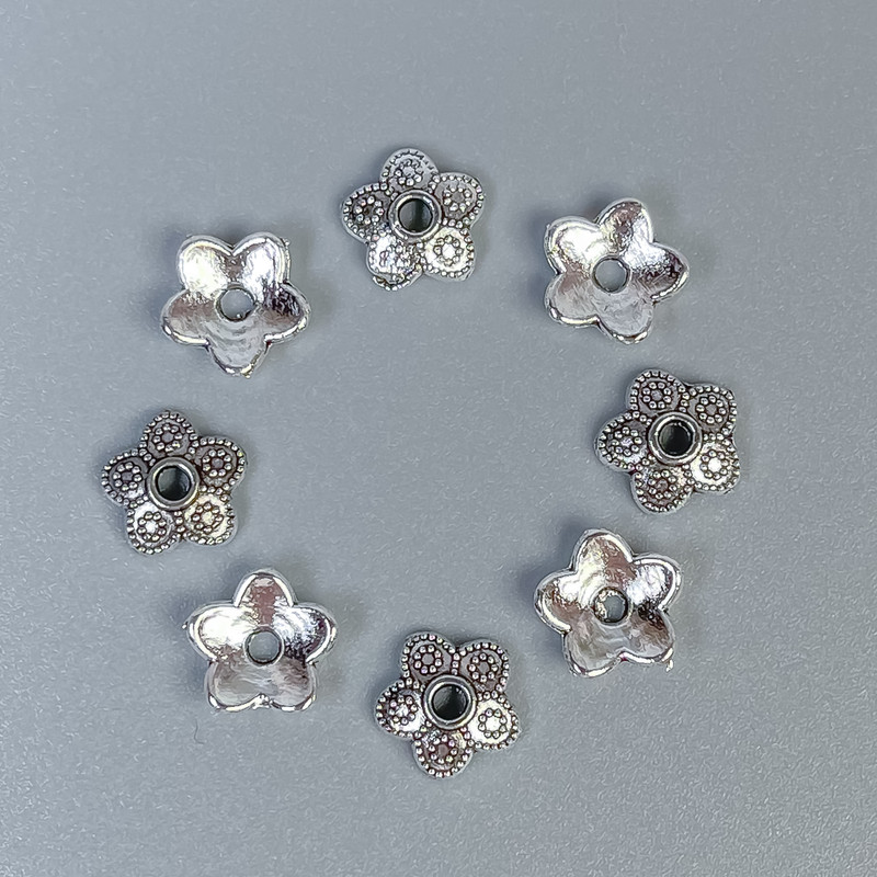 Bead cap findings in silver color, diameter 7mm with approx. 1mm hole, packaging 20 g (~90 pcs)