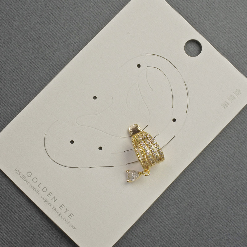 Clip-on earring for the ear, gold-tone metal, 10x14 mm, with white rhinestones