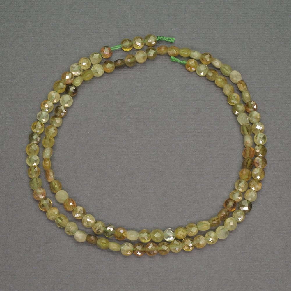 Beads of natural green garnet, coin-shaped, faceted, diameter 4x2 mm +-, length 40 cm +-