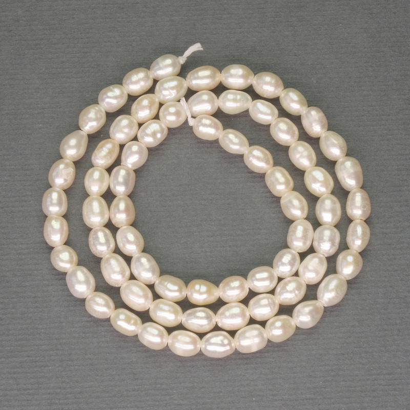 Freshwater white pearls on a thread, diameter 5×4 mm, length 36 cm