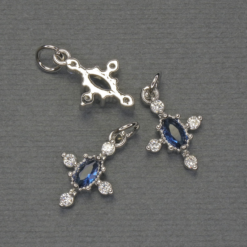 Cross pendant with white and blue crystals, silver-colored metal, diameter 16x10 mm, length approx. 20 mm
