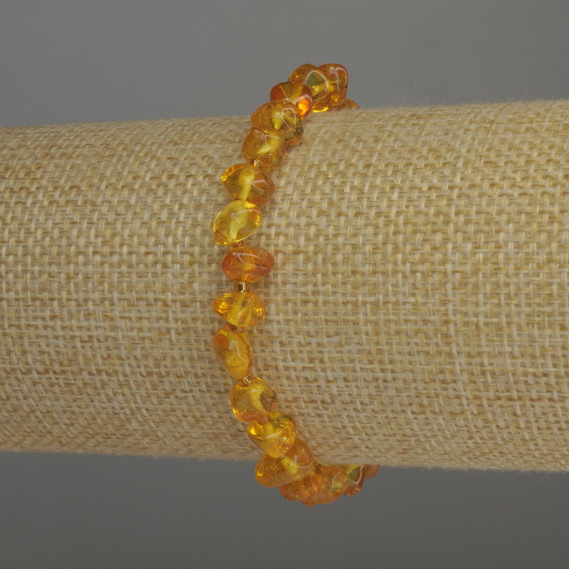 Браслет Бурштин галтівка, діаметр 7х5мм+- бісер 2мм+-, довжина 18см стрейч