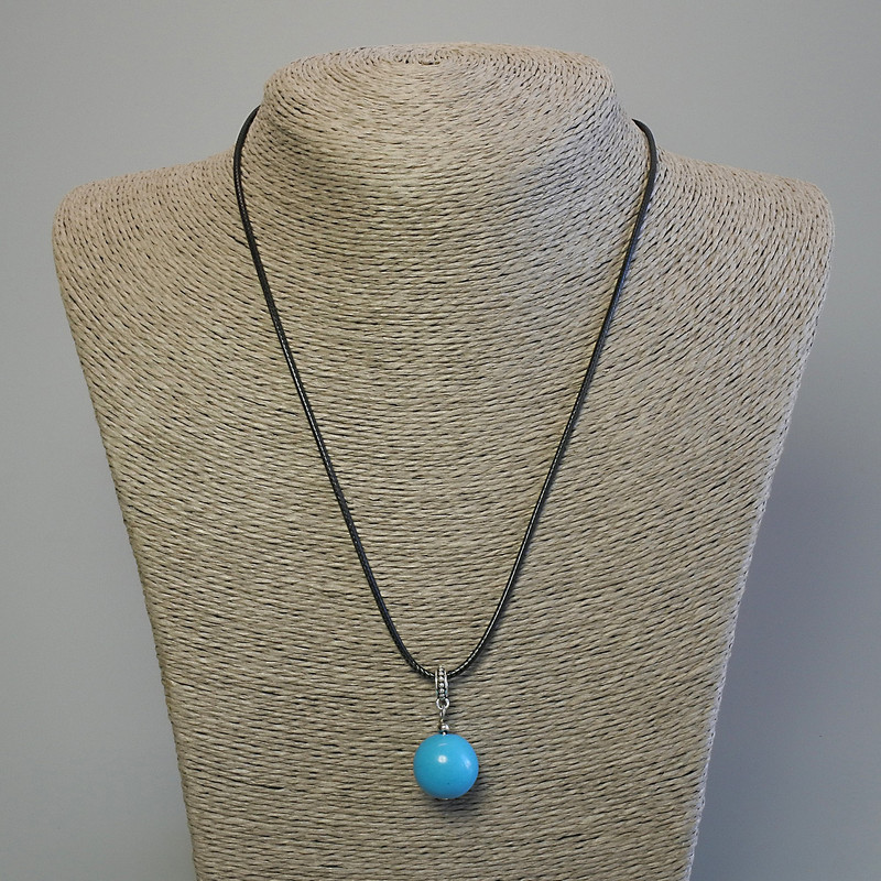 Turquoise ball pendant 16mm +/- on a black waxed cord, 1.5 mm diameter, length 44 cm +/-