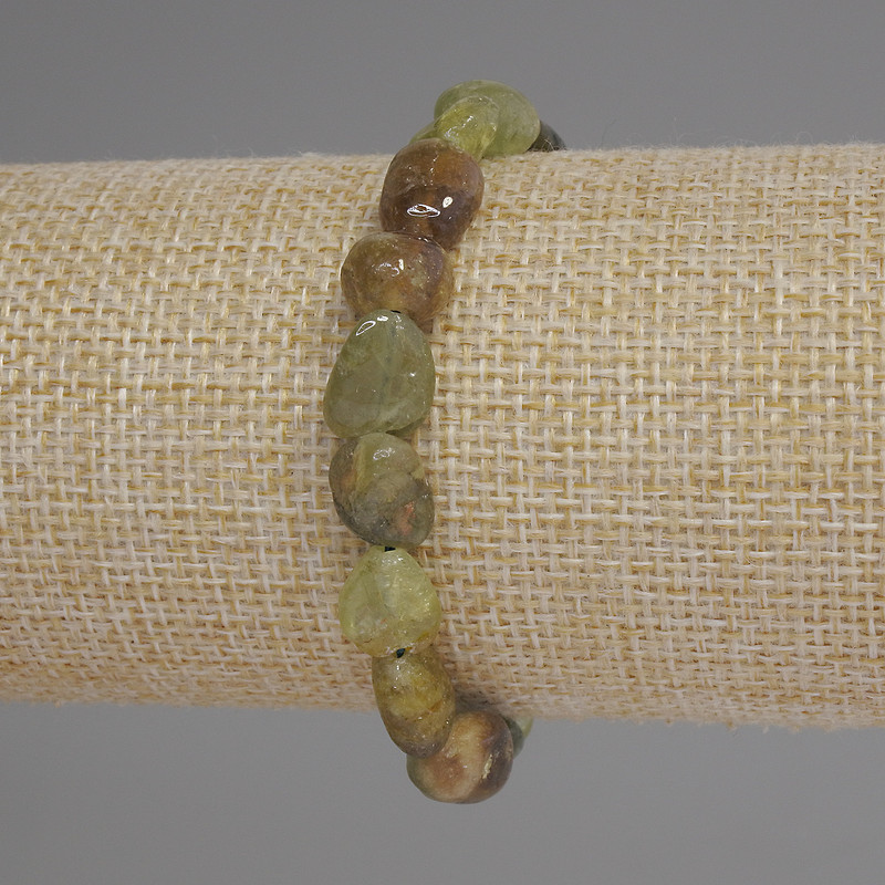 Bracelet with green grossular garnet, faceted beads, diameter 9-12×9 mm, length 18 cm, stretch