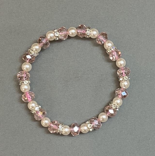 Bracelet with Czech crystal rondelles, 8×6 mm diameter; artificial pearls 6 mm; with metal inserts; stretch bracelet