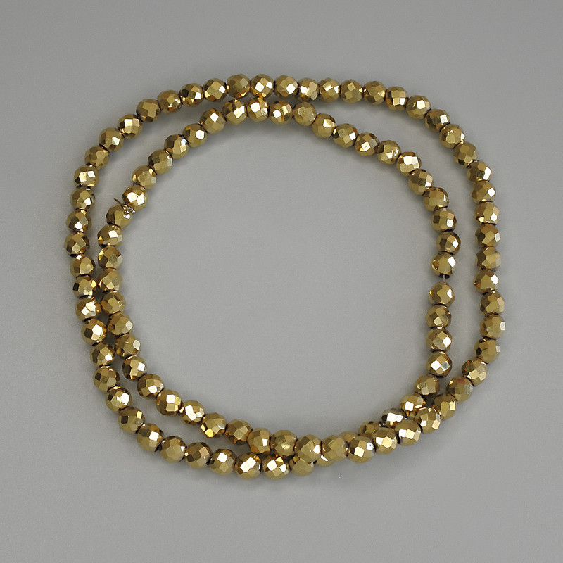 Gold-colored hematite beads, faceted 4mm balls on monofilament, length 38 cm ±