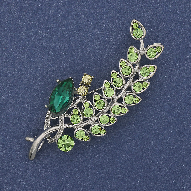 Brooch 'Twig' with multicolored crystals on silver metal 66x26mm +