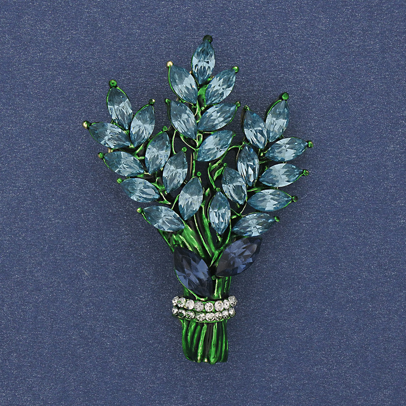 Brooch 'Twig' with blue and white rhinestones, gold-tone metal, 43×29mm +