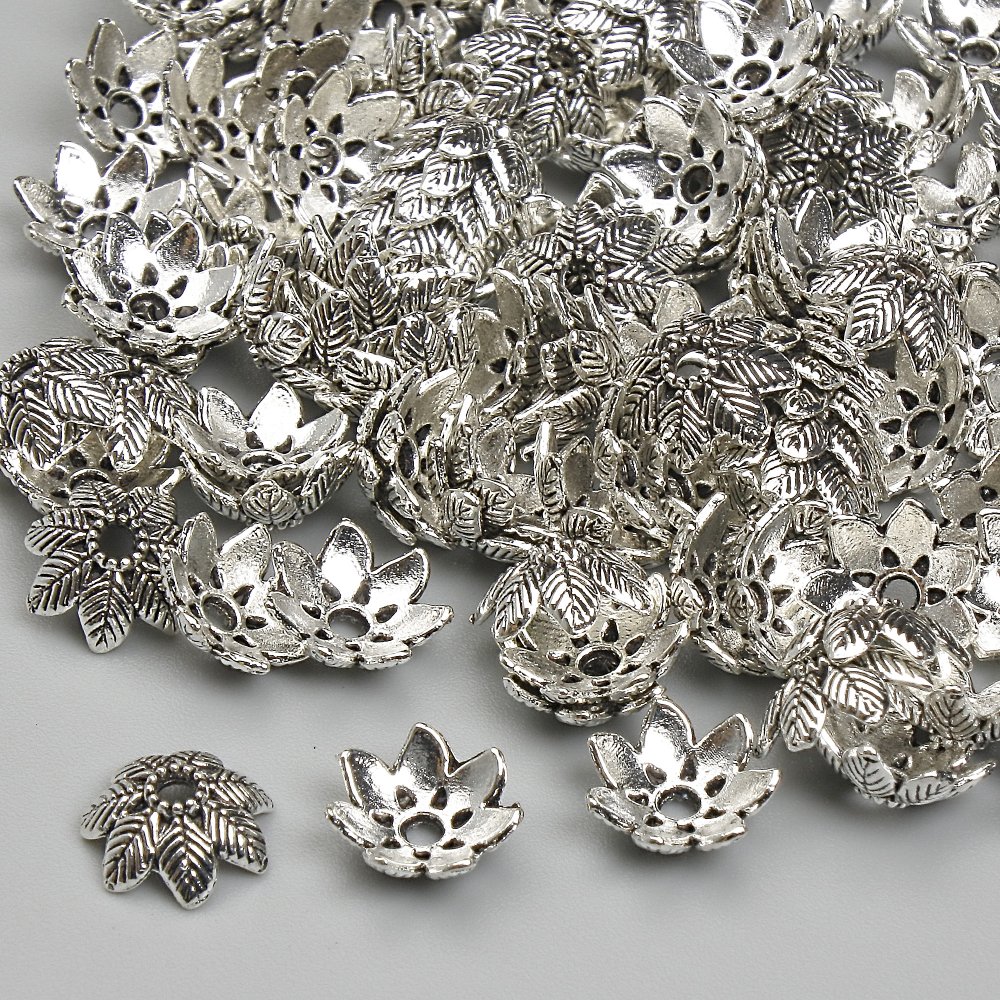 Bead cap findings, silver-colored metal, 7 mm diameter, hole diameter 1.7 mm, packaging 20 g (~110 pcs)