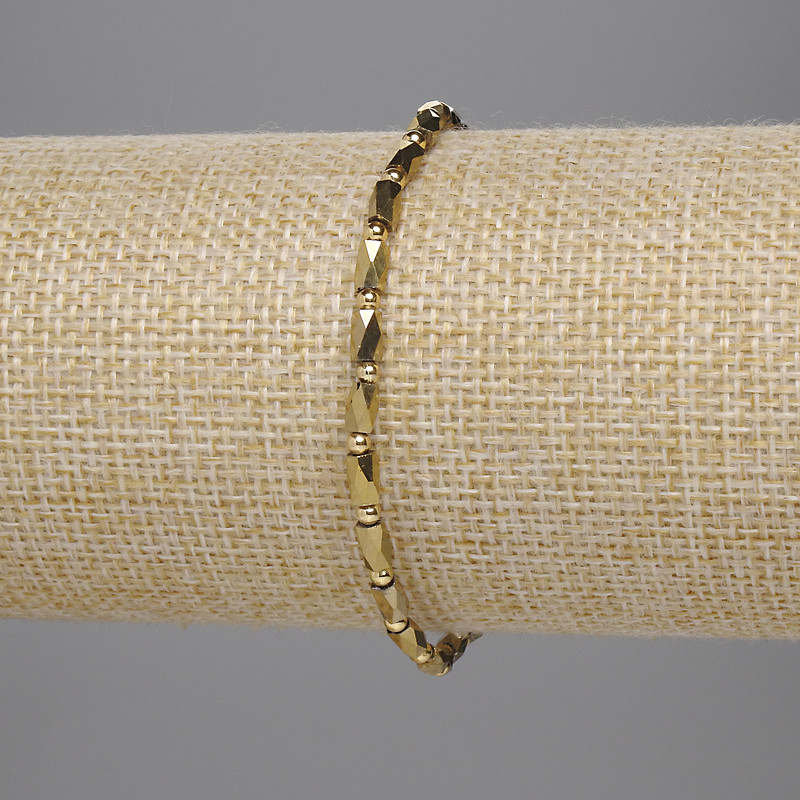 Golden Czech crystal bracelet with faceted cylinders 5×3 mm and 2 mm beads, stretch length 18 cm