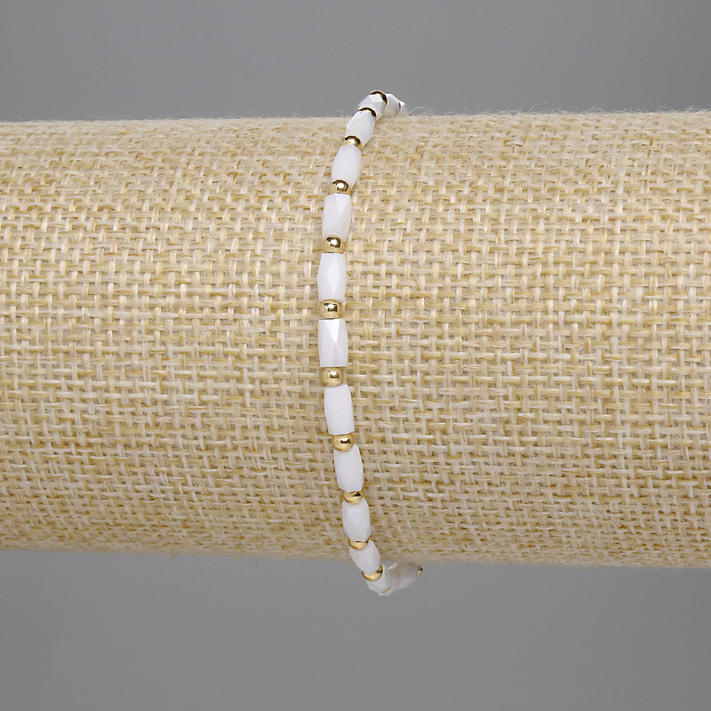 Bracelet with white Czech crystal, faceted cylindrical beads 5x3 mm, 2 mm beads, 18 cm length, stretch