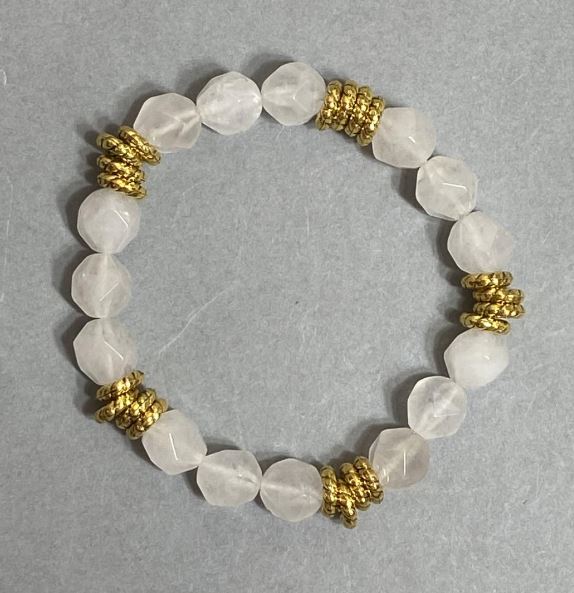 Elastic bracelet with faceted rock crystal beads 10x9 mm ±, with metal inlays, length 18 cm ±