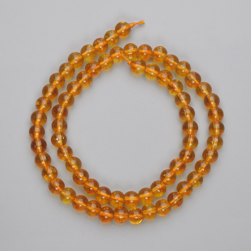 Citrine beads, pressed smooth spheres, 6mm diameter, on a 37 cm strand