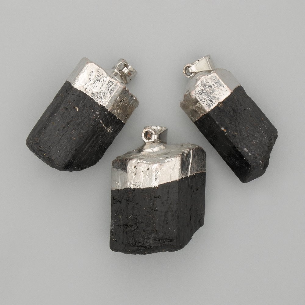 Pendant with unpolished tourmaline stone, diameter approximately 28x18 mm, length 45 mm+