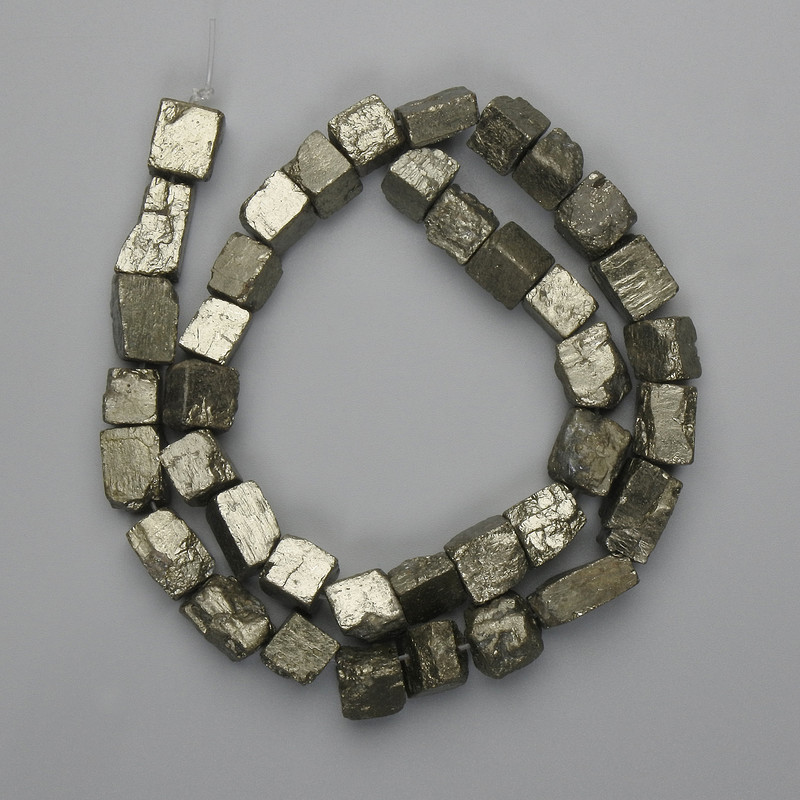 Pyrite beads, natural stone, unpolished, tumbled, diameter 4–12×7–11 mm, length 38 cm on thread