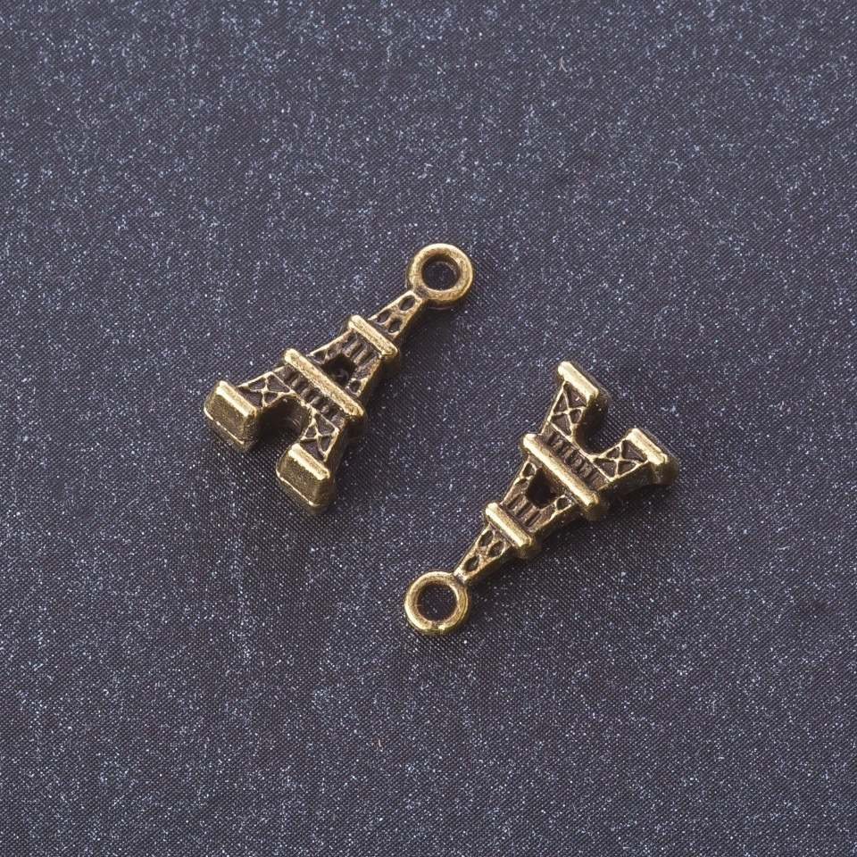 Pendant findings 'Eiffel Tower' metal color Bronze 1.6x0.8 cm finish 20 g +/- 19 pcs