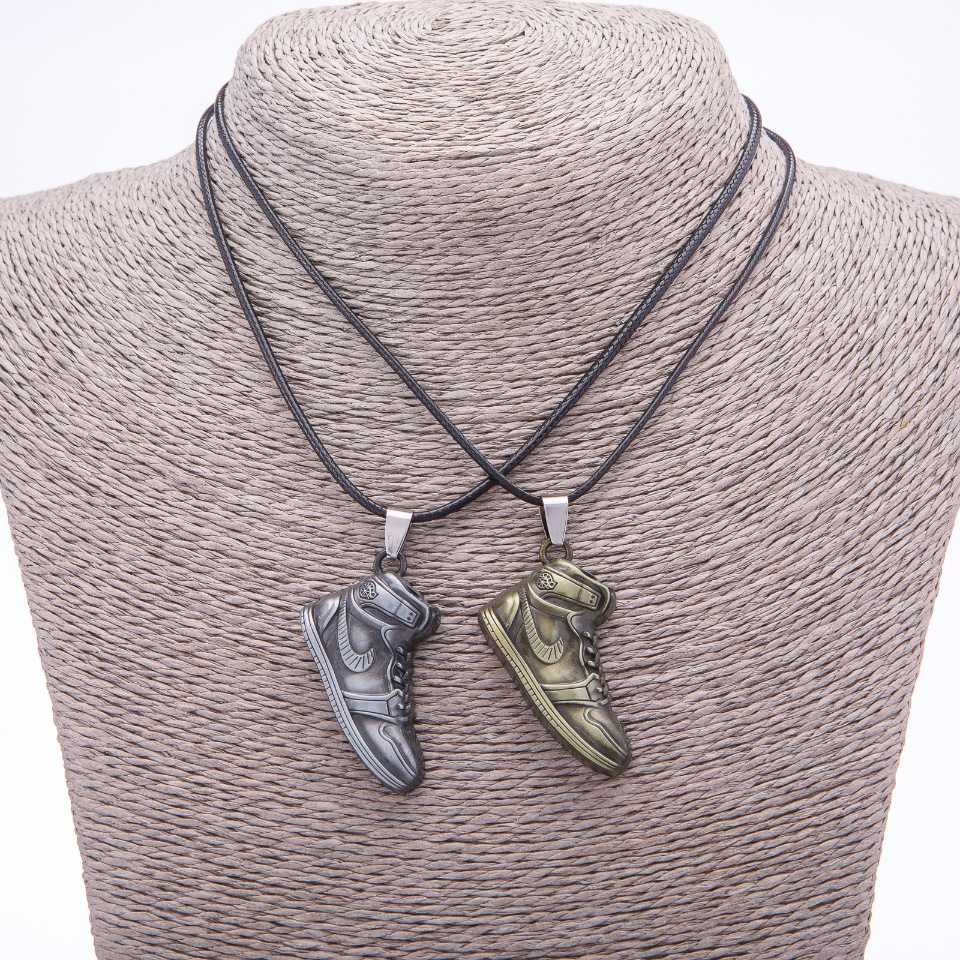 Pair Friendship Pendant: Sneakers on a Cord, length 45 cm, metal color 'Silver and Bronze'