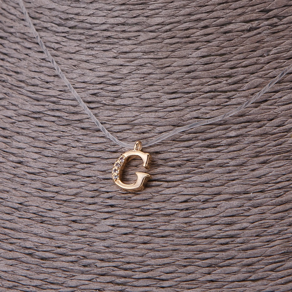 Pendant, 9 mm diameter on invisible silicone cord, length 39–44 cm