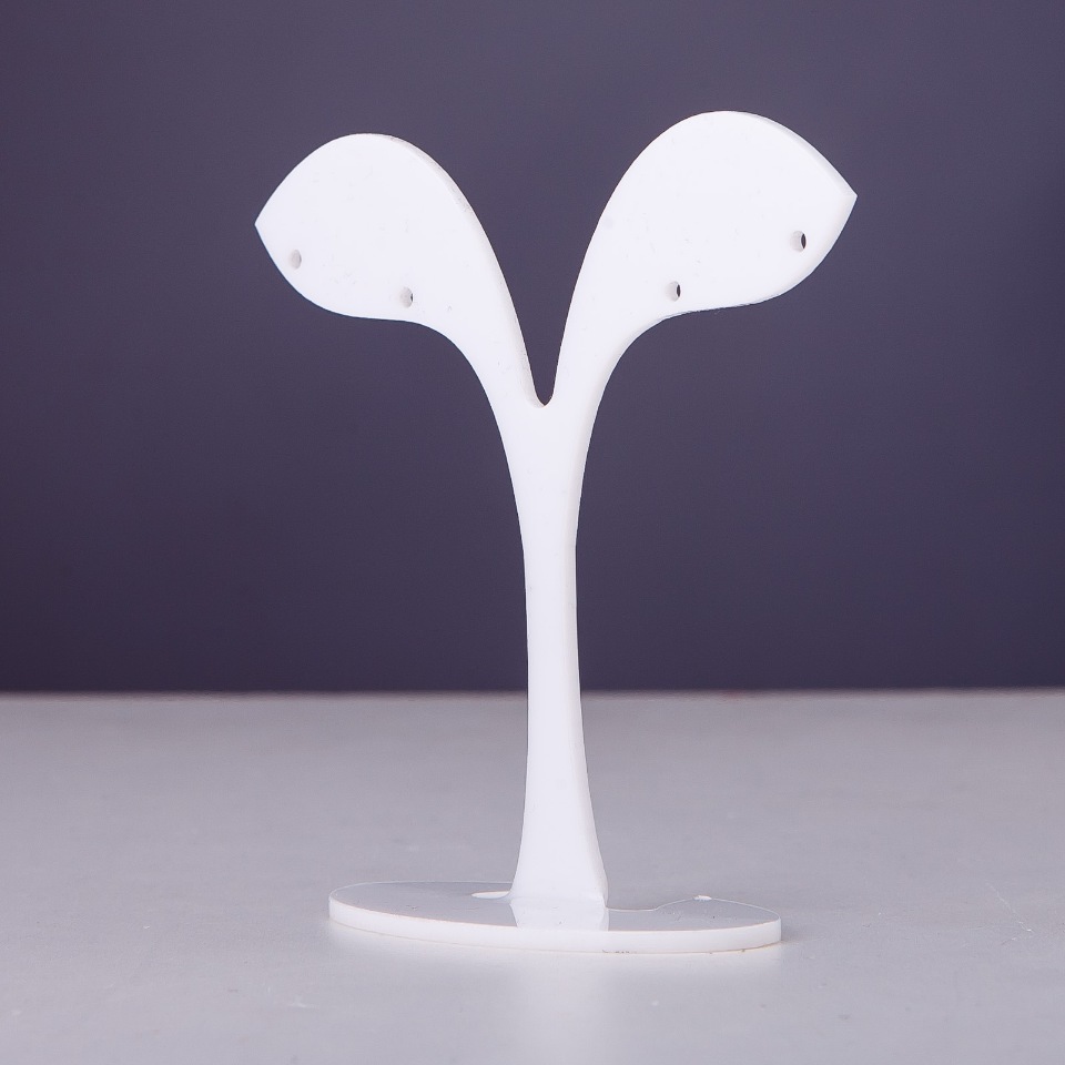 White plastic jewelry stand, 7 cm tall, 7 cm wide