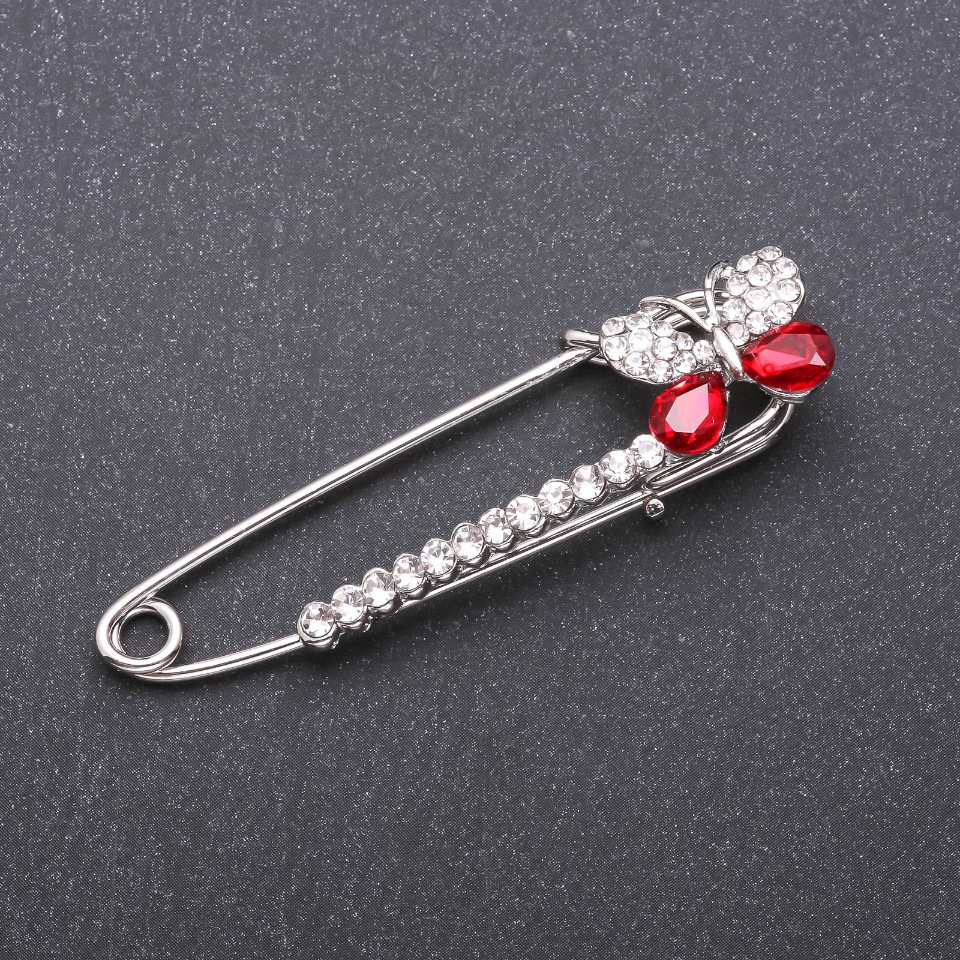 Brooch pin with red glass crystals, 66×15 mm, white metal