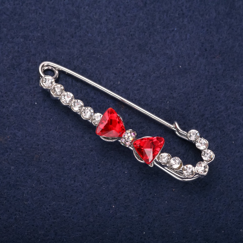 Bow Brooch Pin with White Crystals and Red Stones, 64x18 mm, Silver-Colored Metal