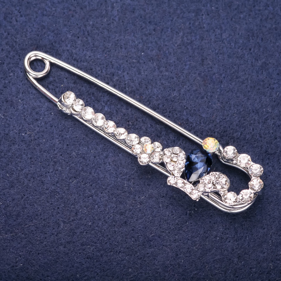 Brooch-pin 'Crown' with blue stone and white crystals, 76x18 mm, silver-tone metal