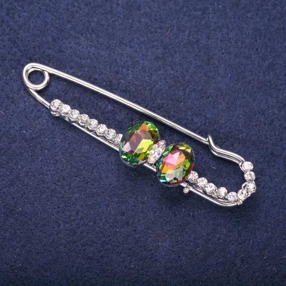 Brooch pin with white crystals, raspberry and green stones, 72×20 mm, silver-colored metal