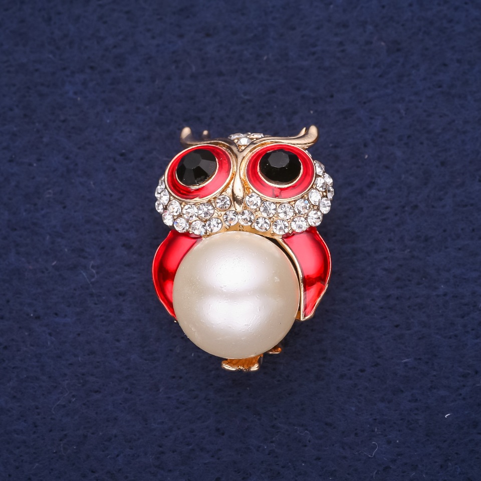Brooch 'Owl with Pearl Bead', enamel and crystals, colors white, red, black, 32×22 mm, gold-tone metal