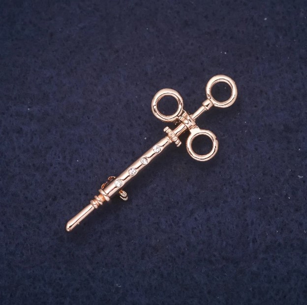Brooch 'Syringe with Crystals' in Golden Metal 17x45mm