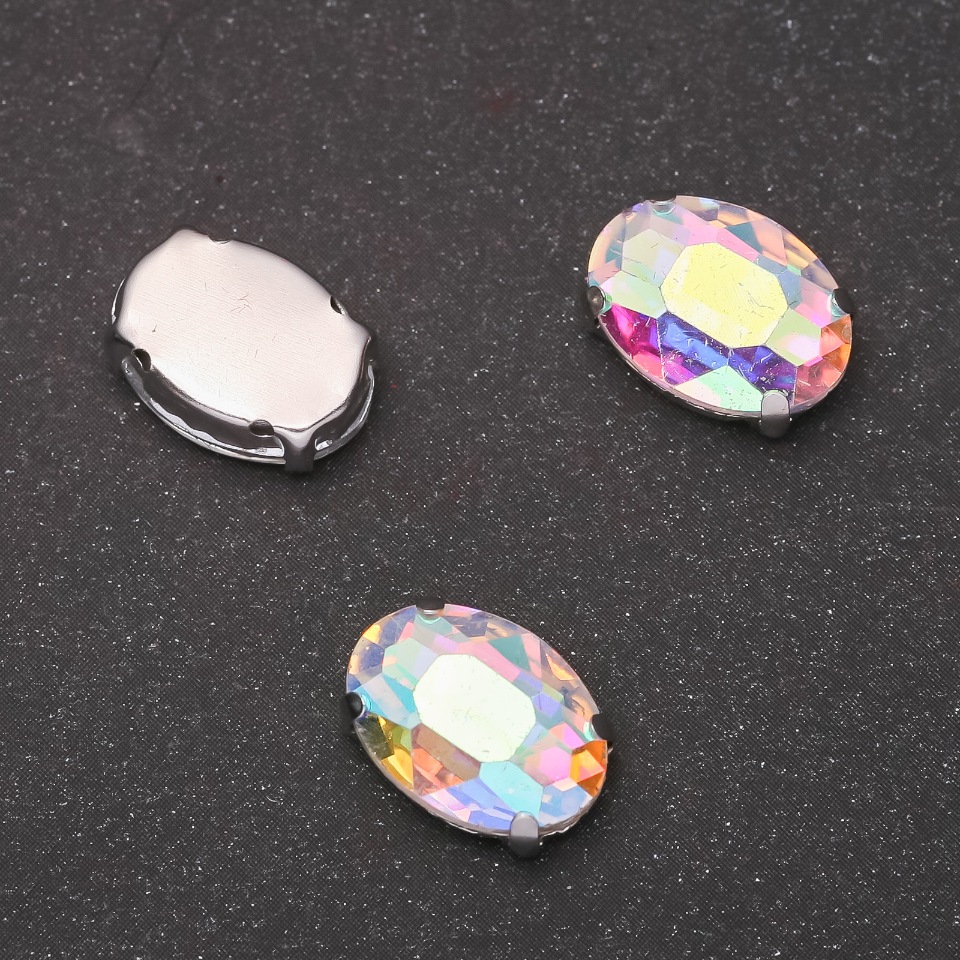Price per pack / 10 pcs. Sew-on crystal in prong setting, Oval 10×14 mm, iridescent