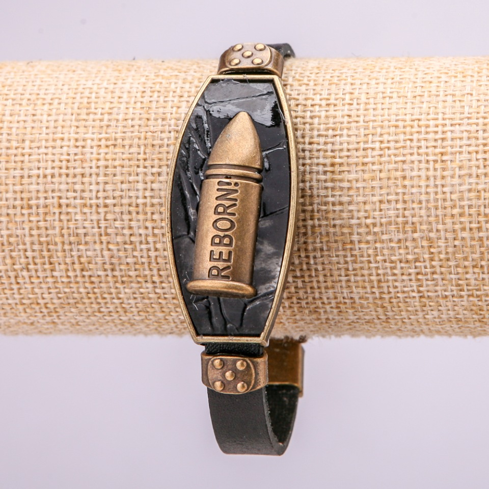Bracelet with metal inlays, 21 cm long, 20 mm thick, eco leather, black, with a clasp