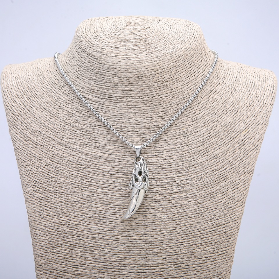 Pendant 'Iron Fang' 47×13 mm on a chain, length 70 cm; silver-colored metal